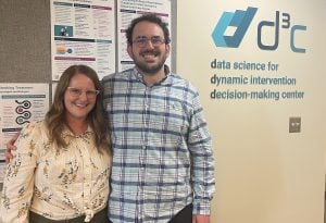 Lizbeth ‘Libby’ Benson & Zack Winograd in front of d3c: data science for dynamic intervention decision-making center